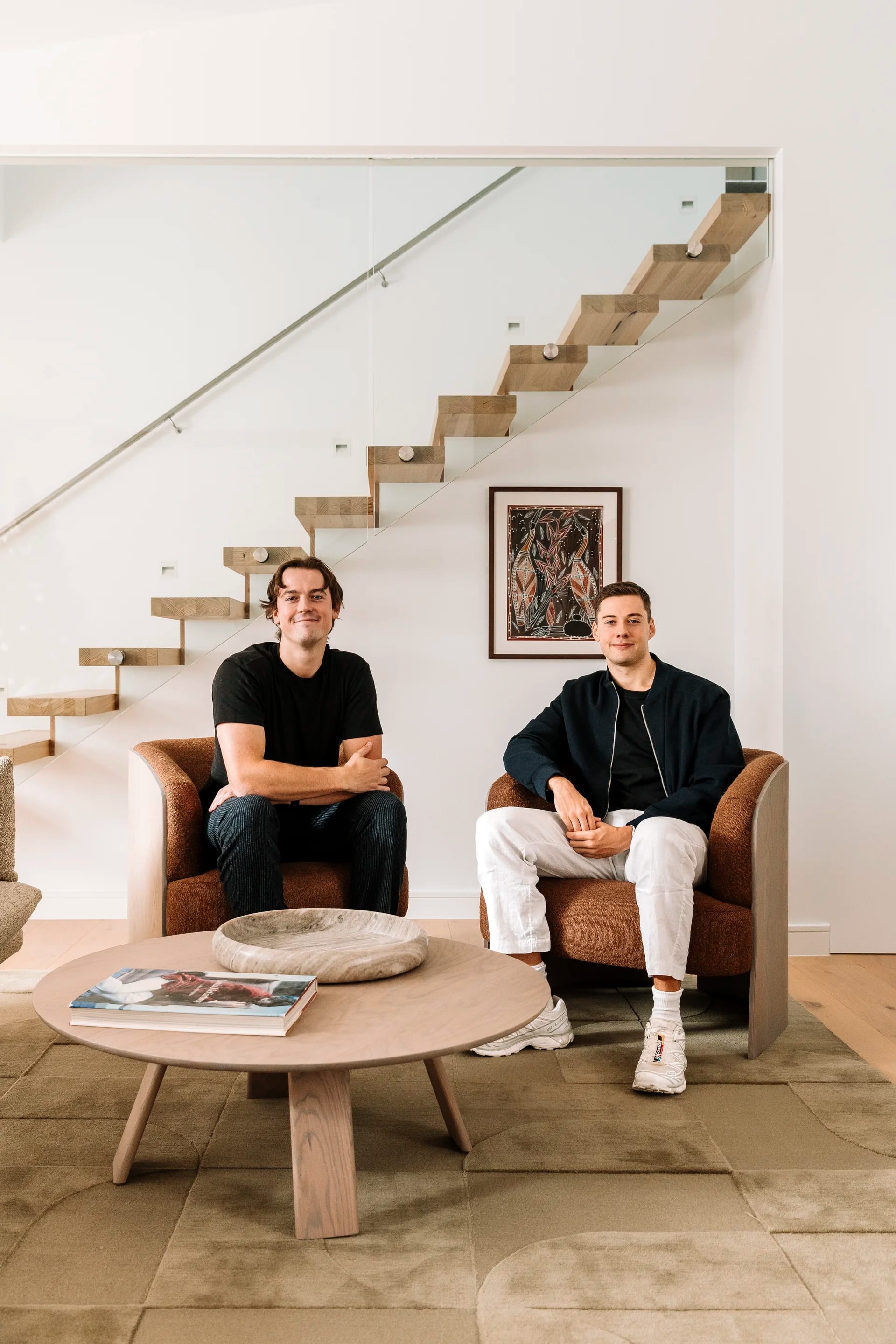 Tyler M. and Angus M., co-founders of TMJ Tutoring, seated together in a relaxed setting