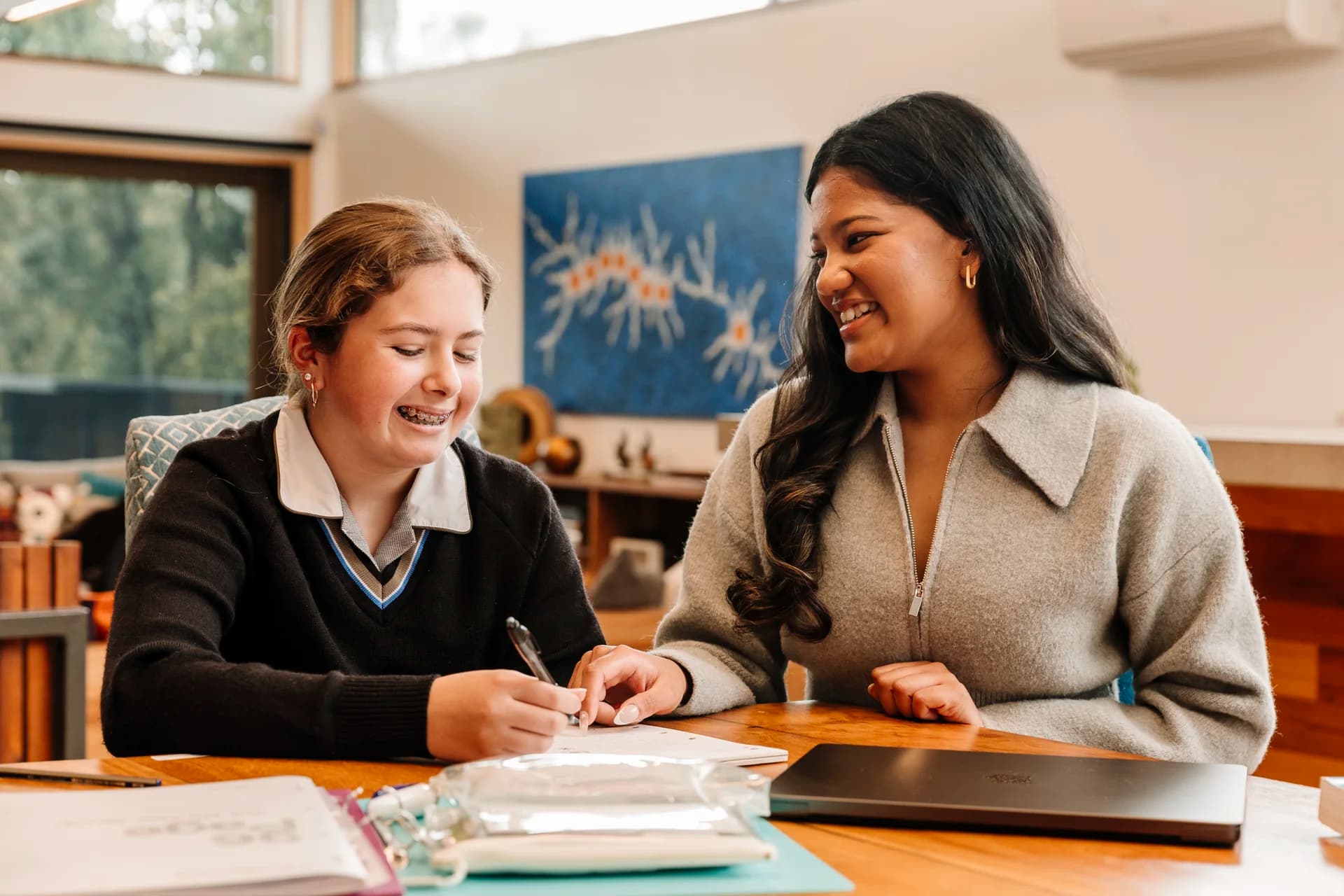 Tutor working with a student at home
