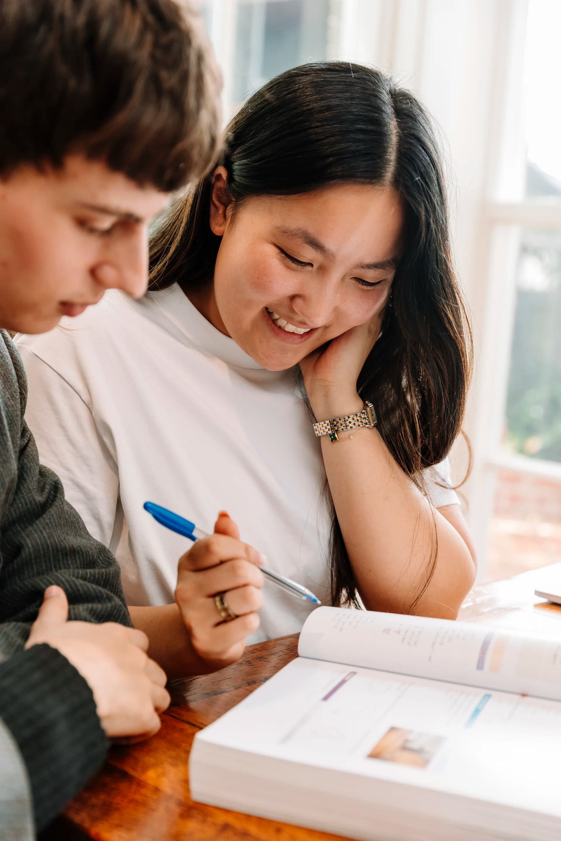 A tutor and student working through a problem together, one-on-one
